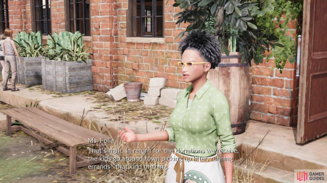 Ms. Folia can be found standing outside Leaf House Orphanage. 