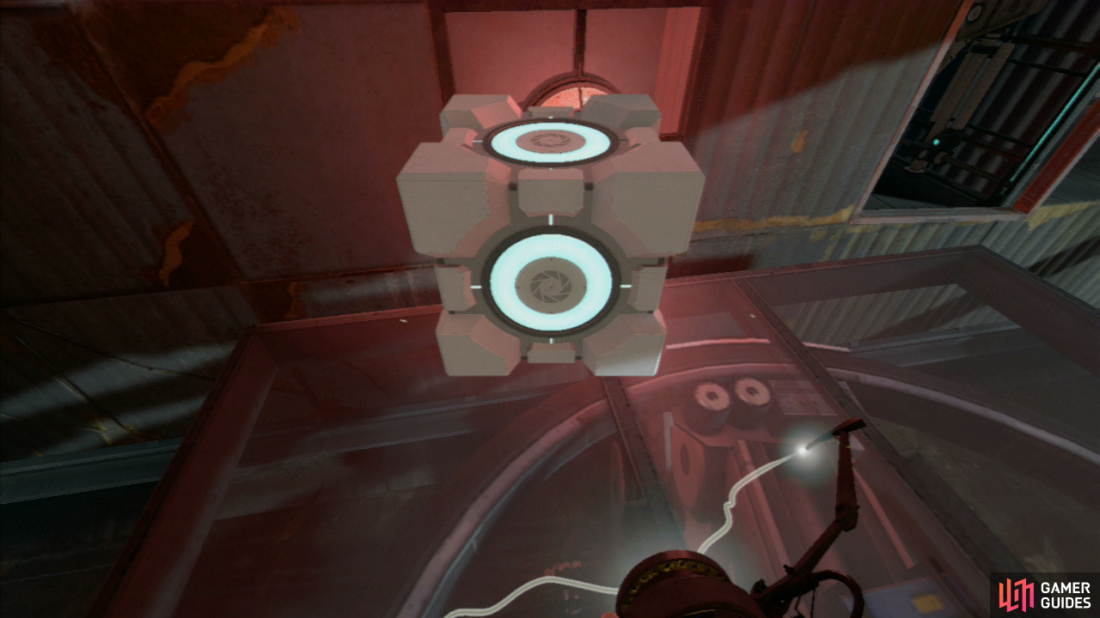 Immediately pick up the Companion Cube and turn around, this allows you to block the laser beam as you approach it, stopping the platform (so make sure you’re standing near the left end of the platform).