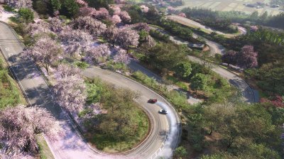Taking the scenic route through the hills as cherry blossoms drift across one of Horizon Japan&rsquo;s mountain roads.