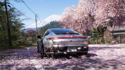 Cruising beneath falling sakura petals during springtime somewhere outside the city.