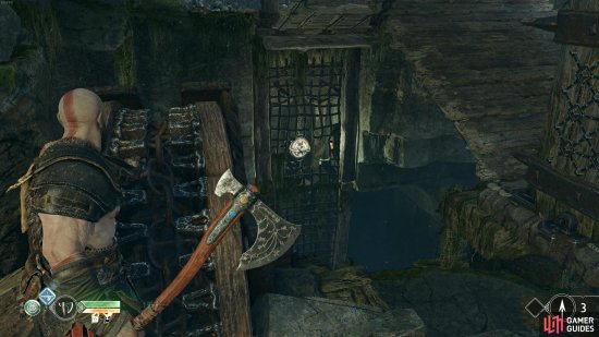 Throw the axe at the symbol when its revealed through the gap to lower the bridge.
