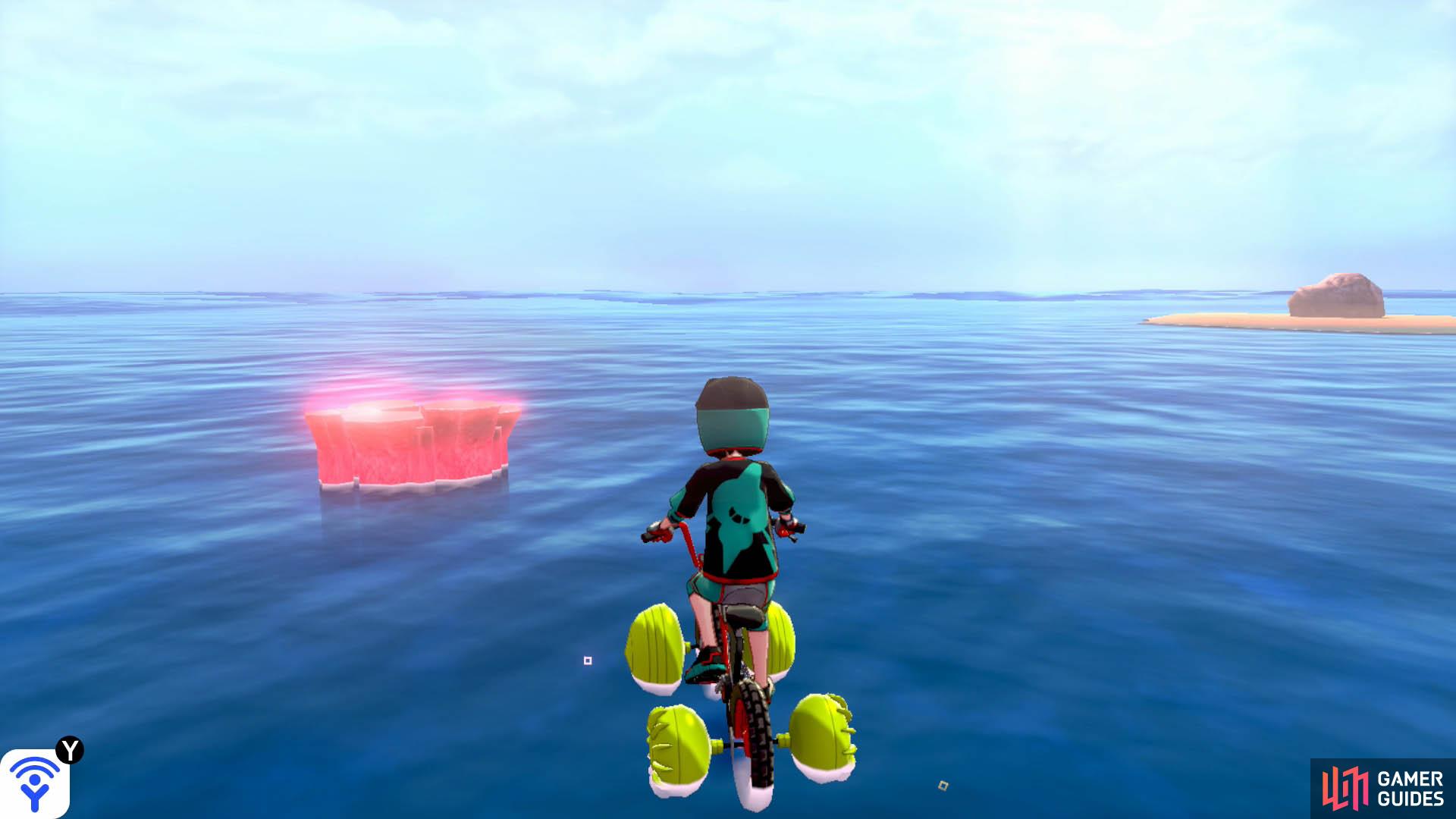 Return to the first islet, directly opposite Armor Station. Straight ahead, in the distance, there should be a den that's near an islet with a boulder. That's the den you're looking for. Expect an incoming Sharpedo.