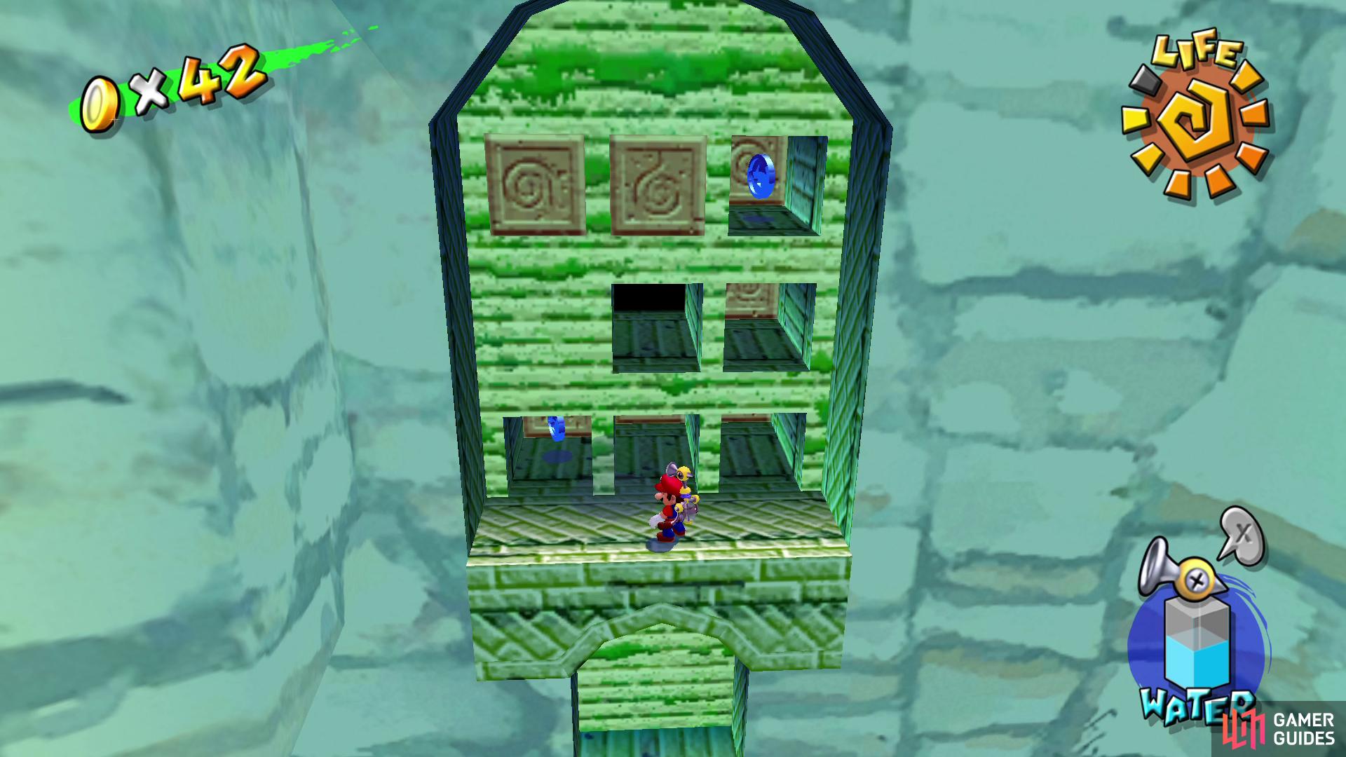 Jump from the top of the cliff to the right to reach this alcove and spray the top right and bottom left blocks for two Blue Coins