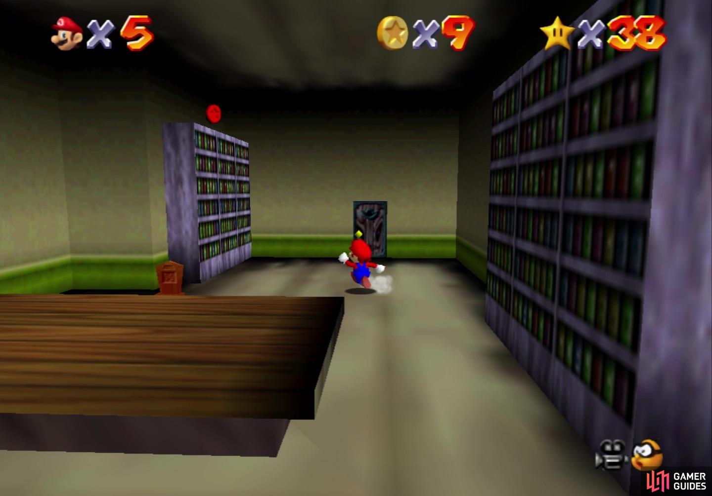 In the same room as the second coin, the third is on the other bookshelf