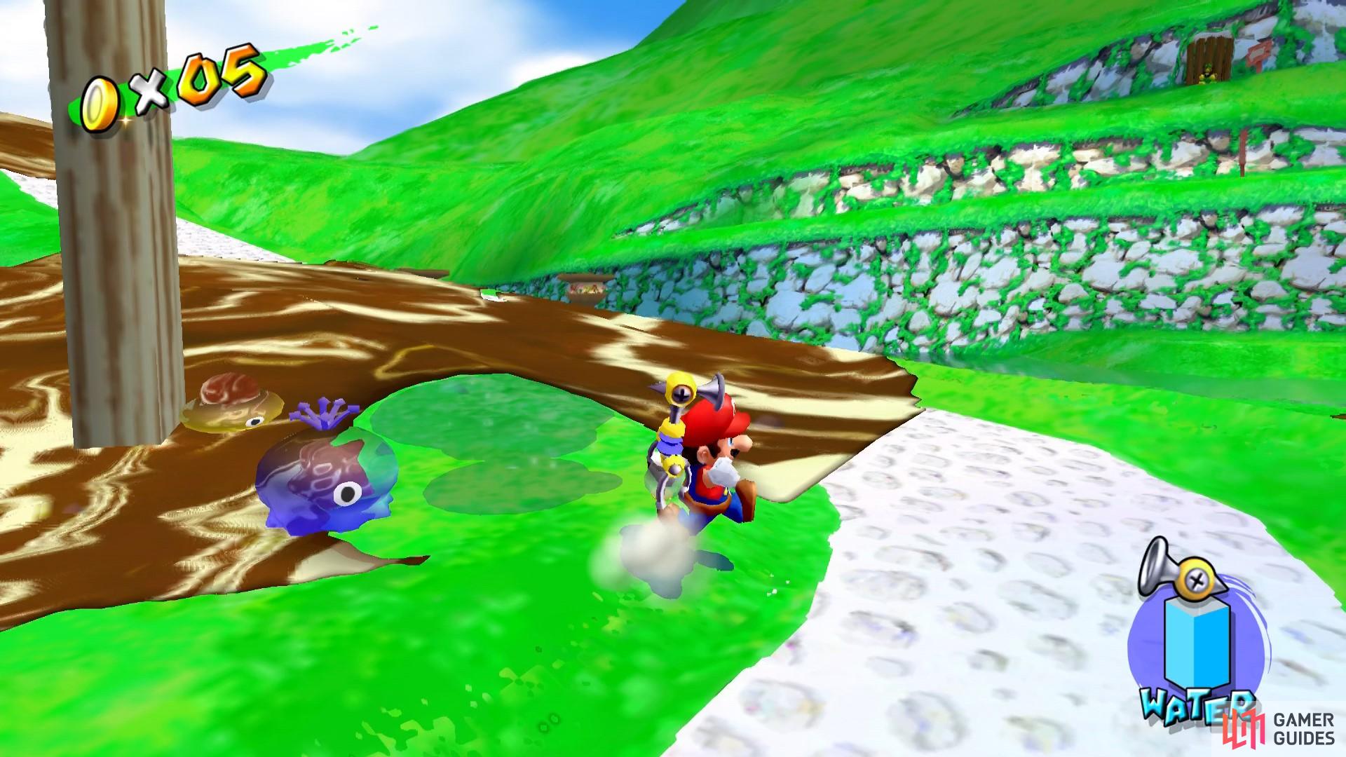 You can use the water shooters or the hover nozzles to clear the goo from the path.