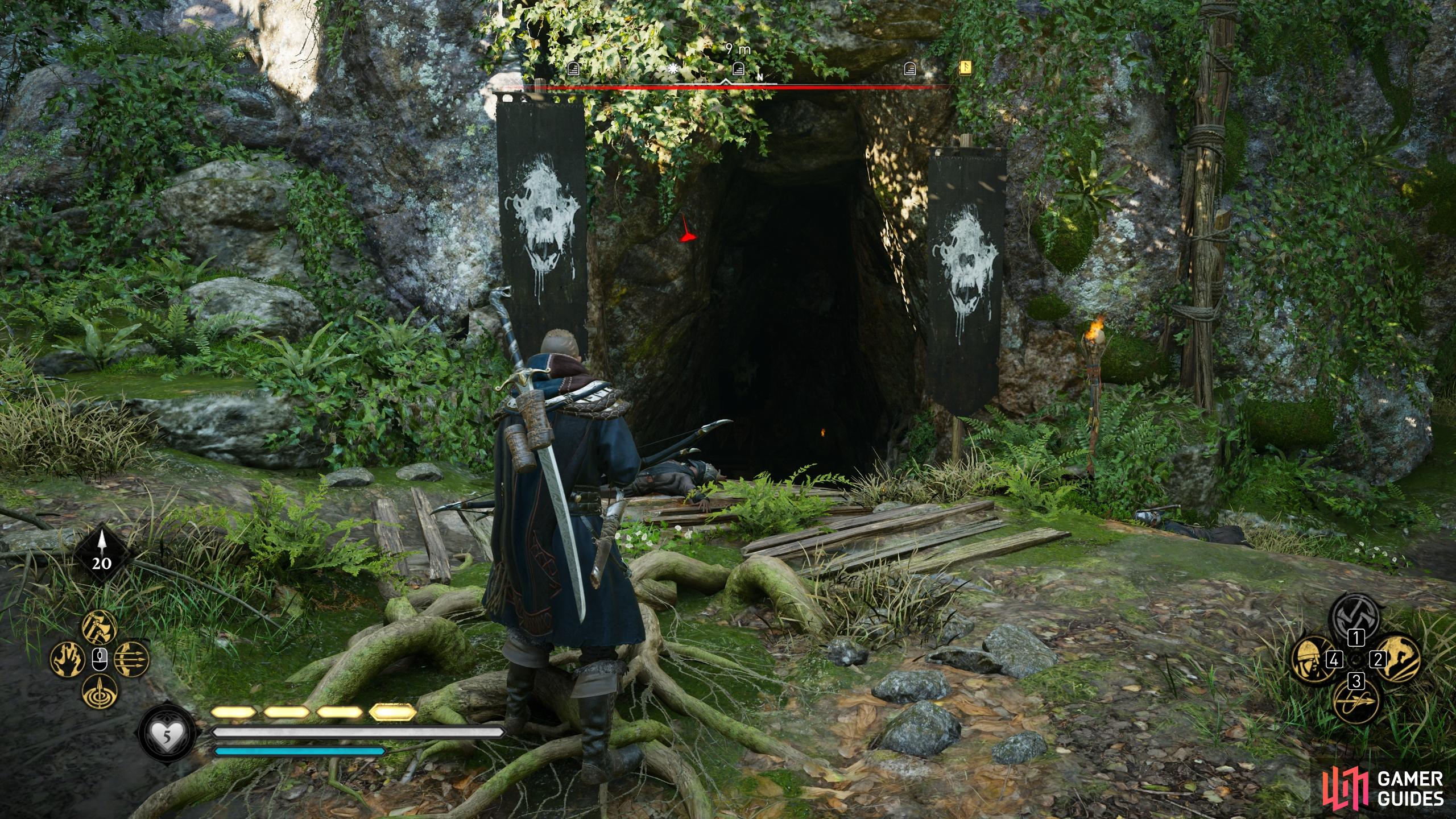 The entrance to the cave is marked by two black and white banners.
