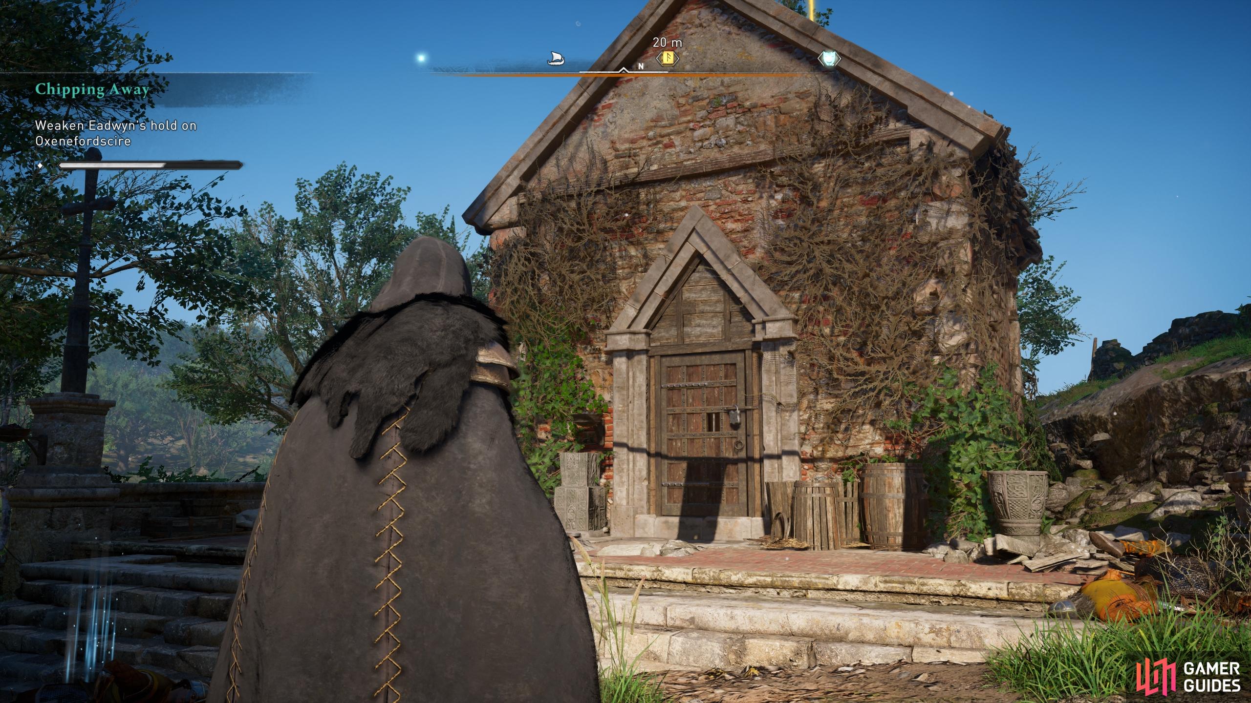 Use the key you found on the ground floor of the tower to enter the chapel to the north.