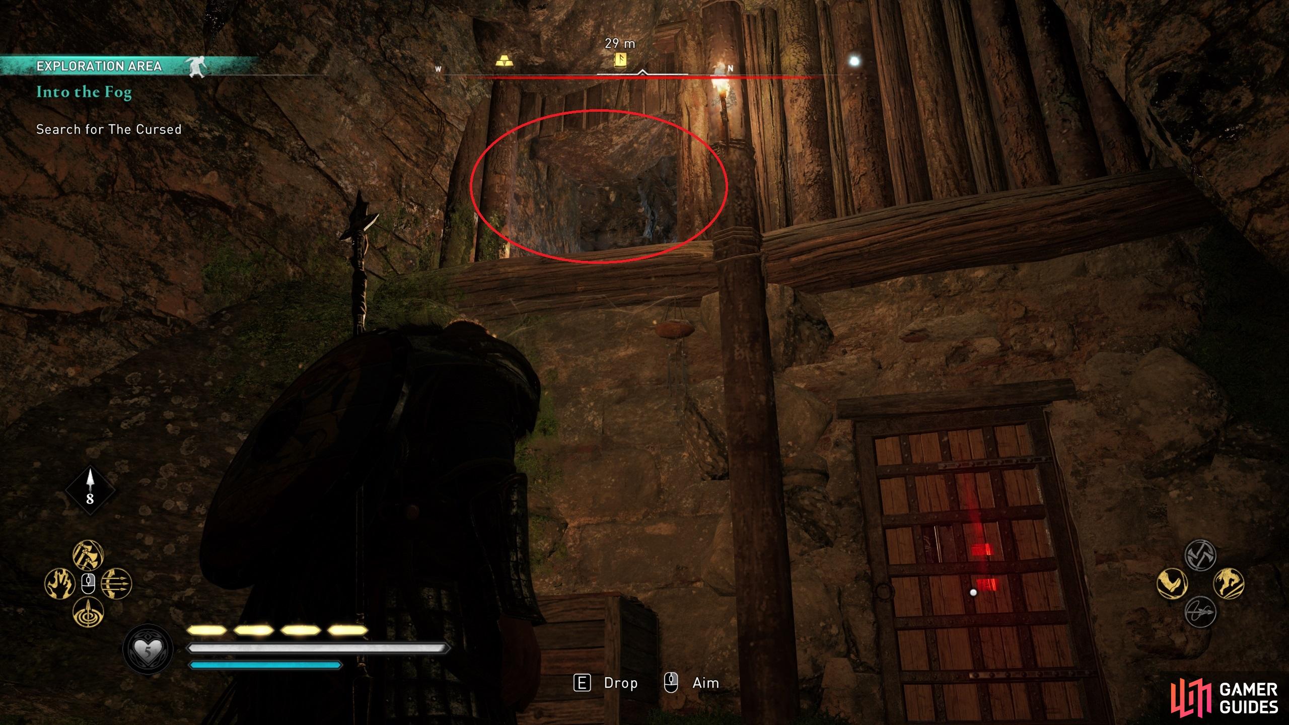 You can enter the hideout through the hole in the wall above the door.