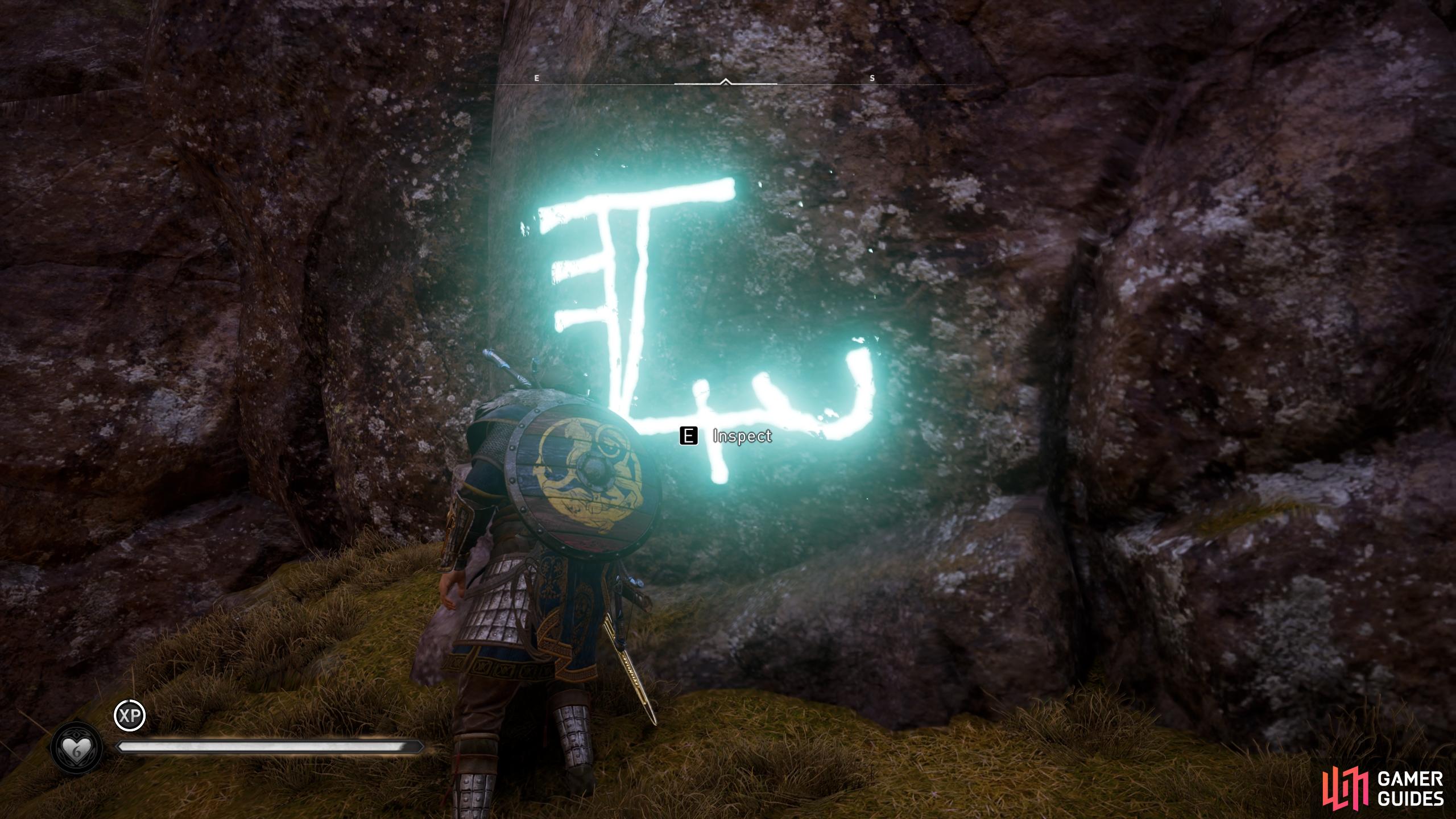 Use Odins Sight to highlight the runic inscription, then interact with it to reveal the entrance.