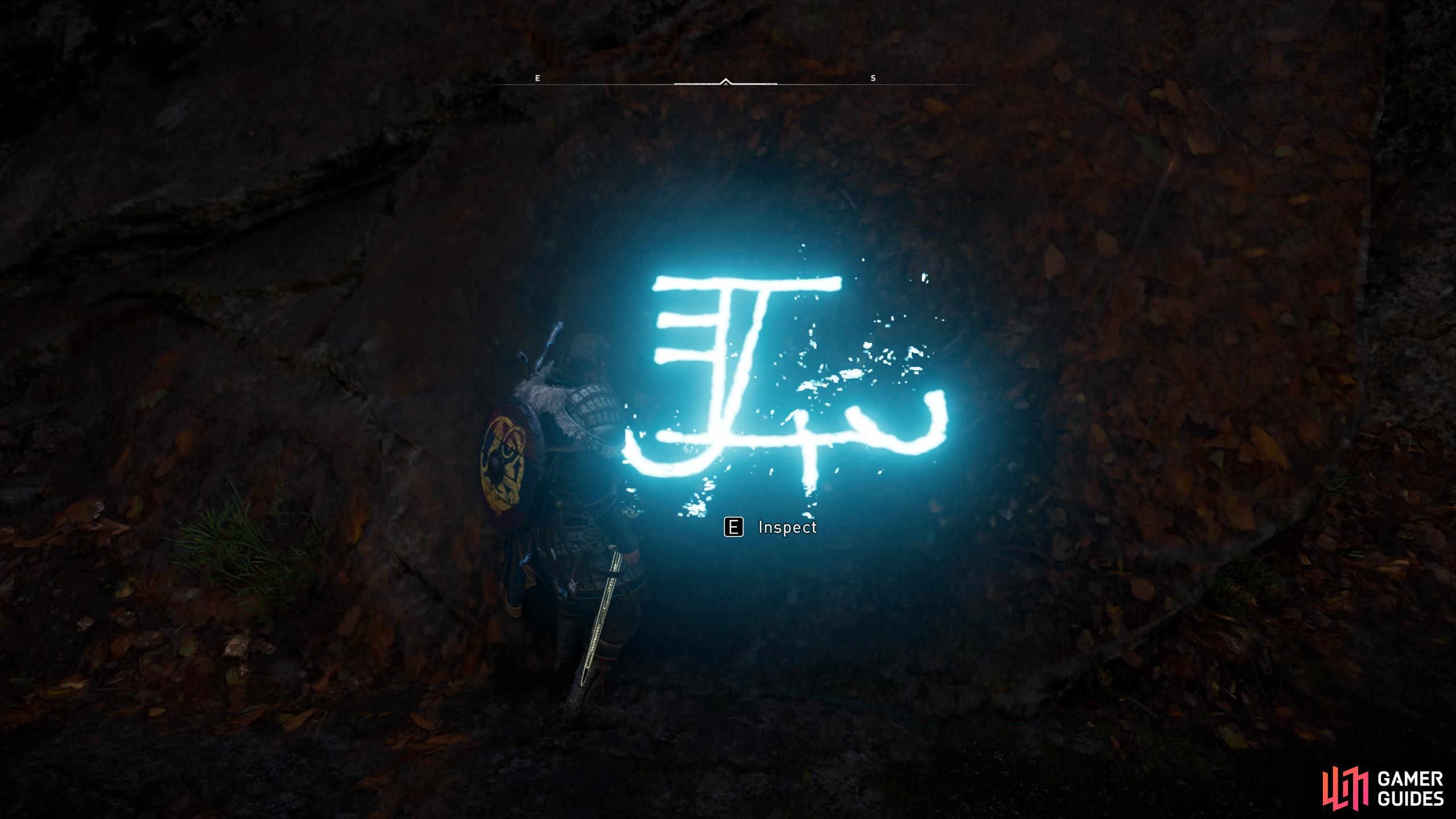 You'll need to interact with the runic inscription to uncover the entrance to the tomb.
