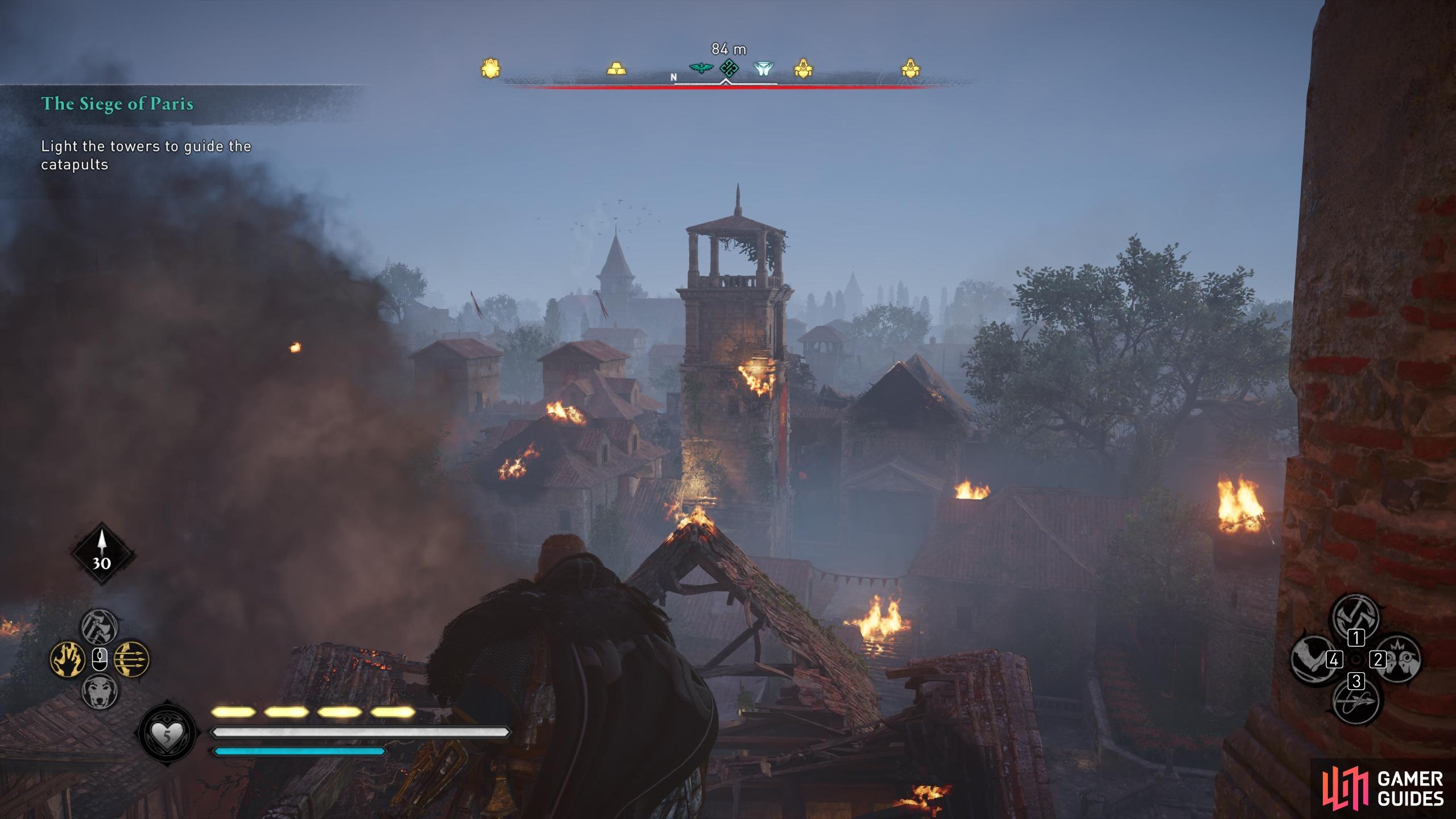 Head to the second tower through the burning building to the north.