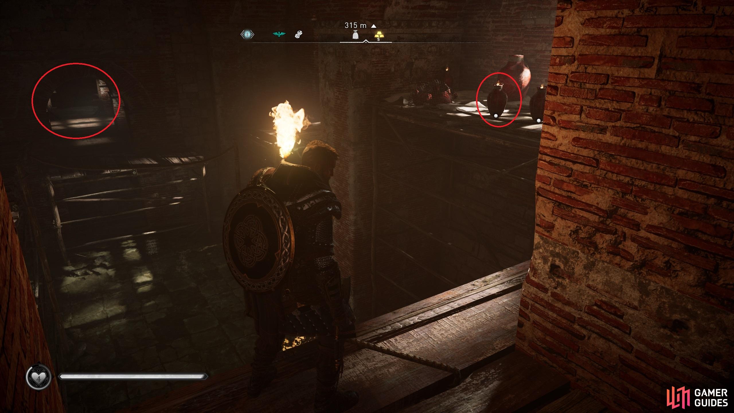 You'll find fire pots on the western side of the open room, which you can use to destroy the blockade on the other side.