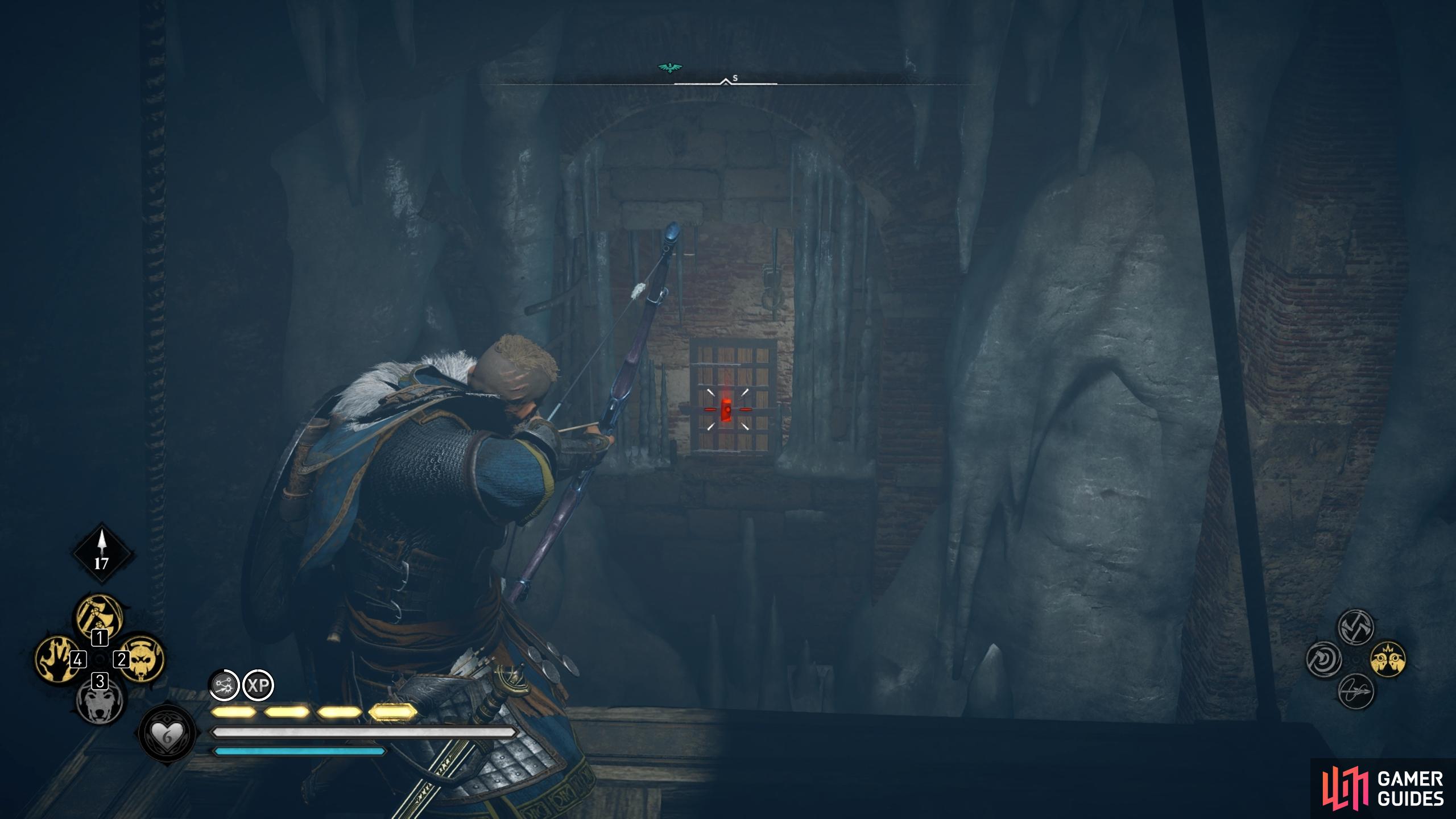 You can shoot the lock to the door from the suspended wooden platforms.