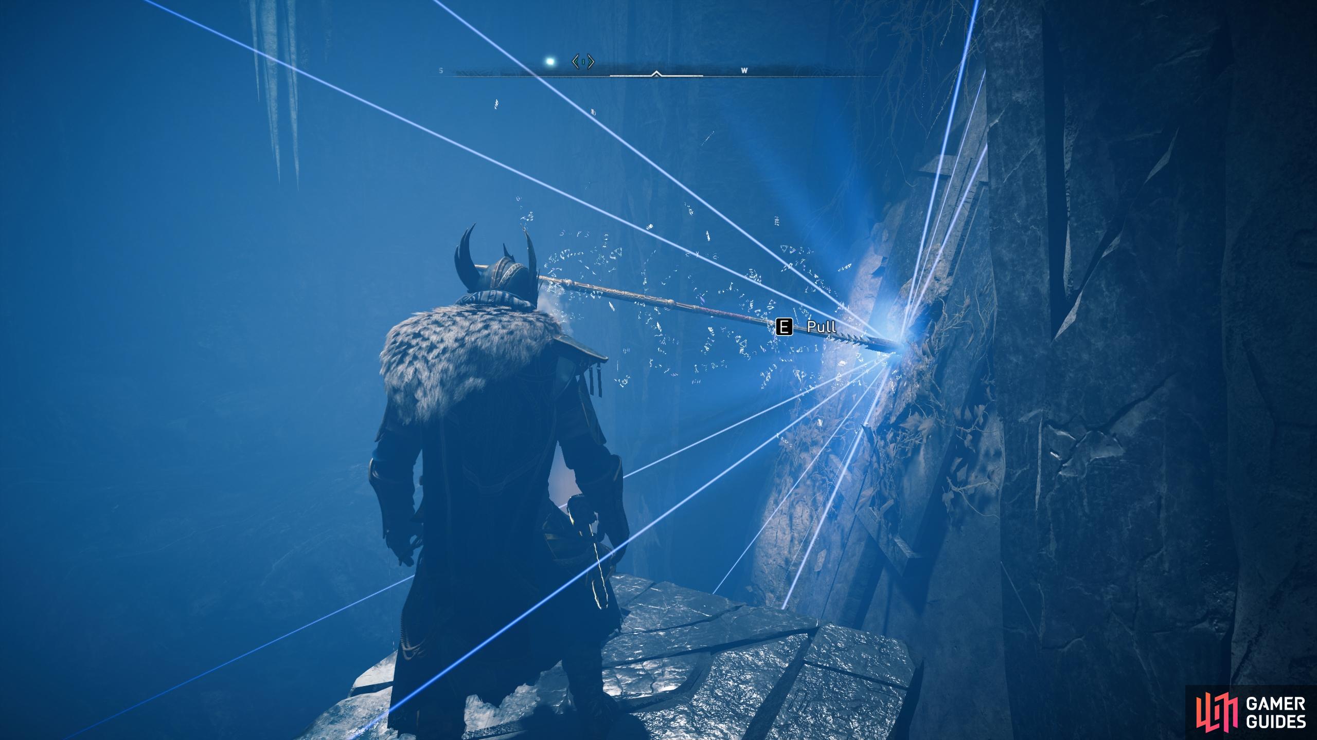 Once you find the spear, all you need to do is interact with it to pull it from the wall.