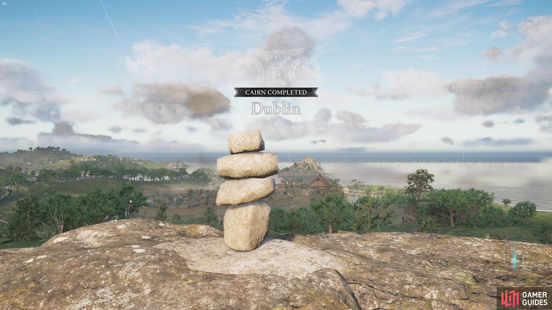 Finally, gently place the smallest rock on top.