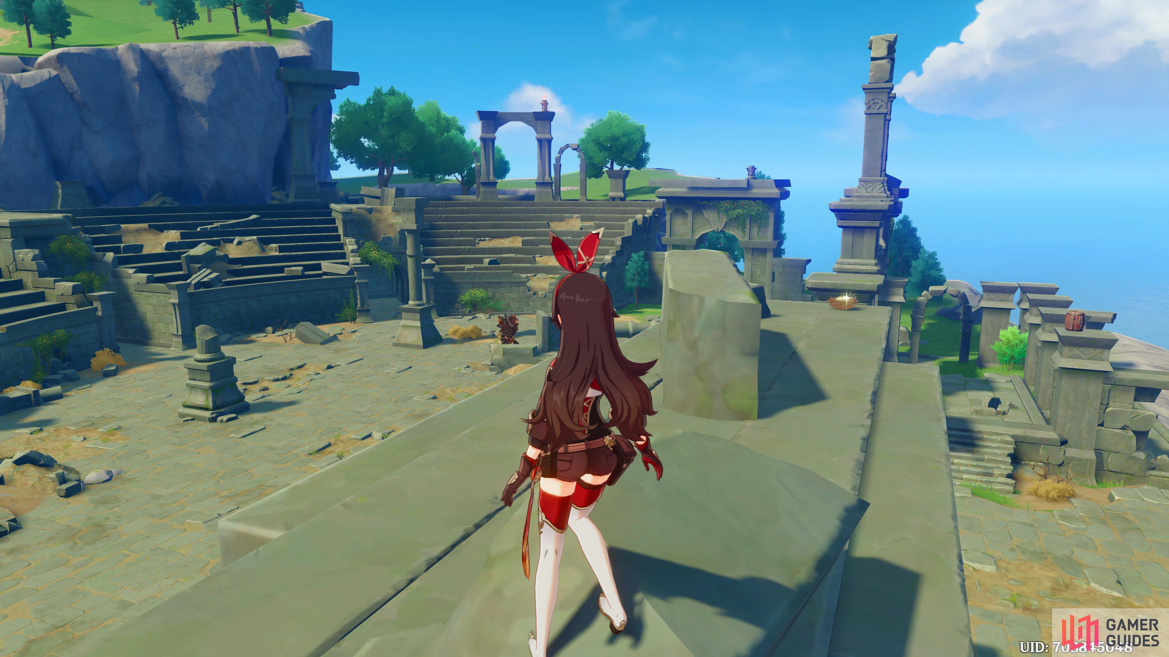 Amber standing on a wall in the ruins of the Thousand Winds Temple.
