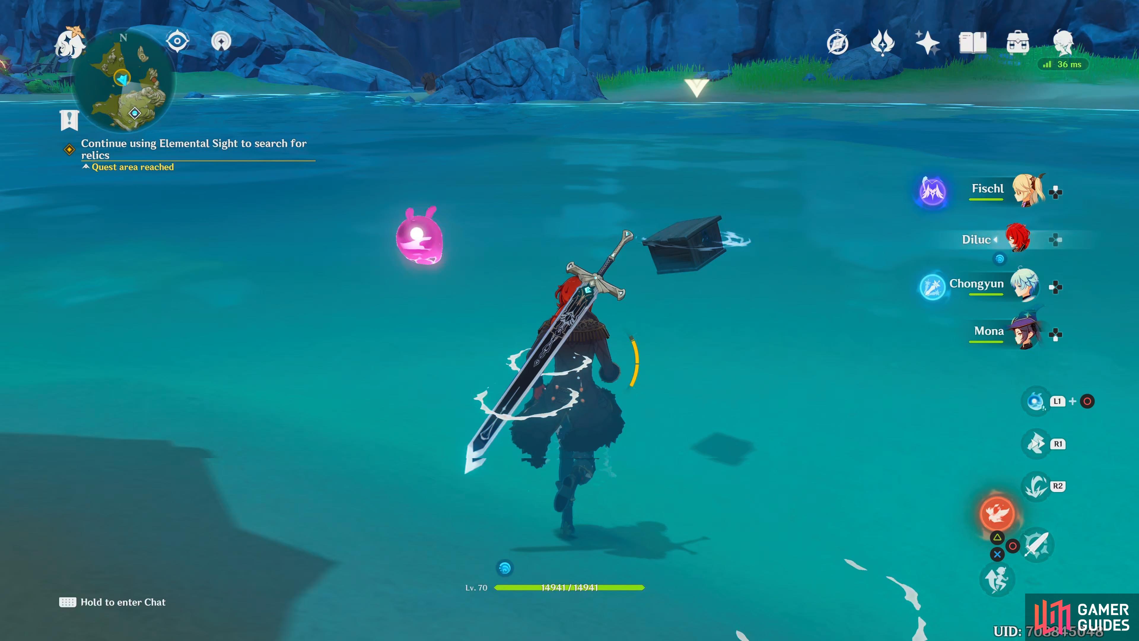 the floating box can be found in the sea, behind the rock.