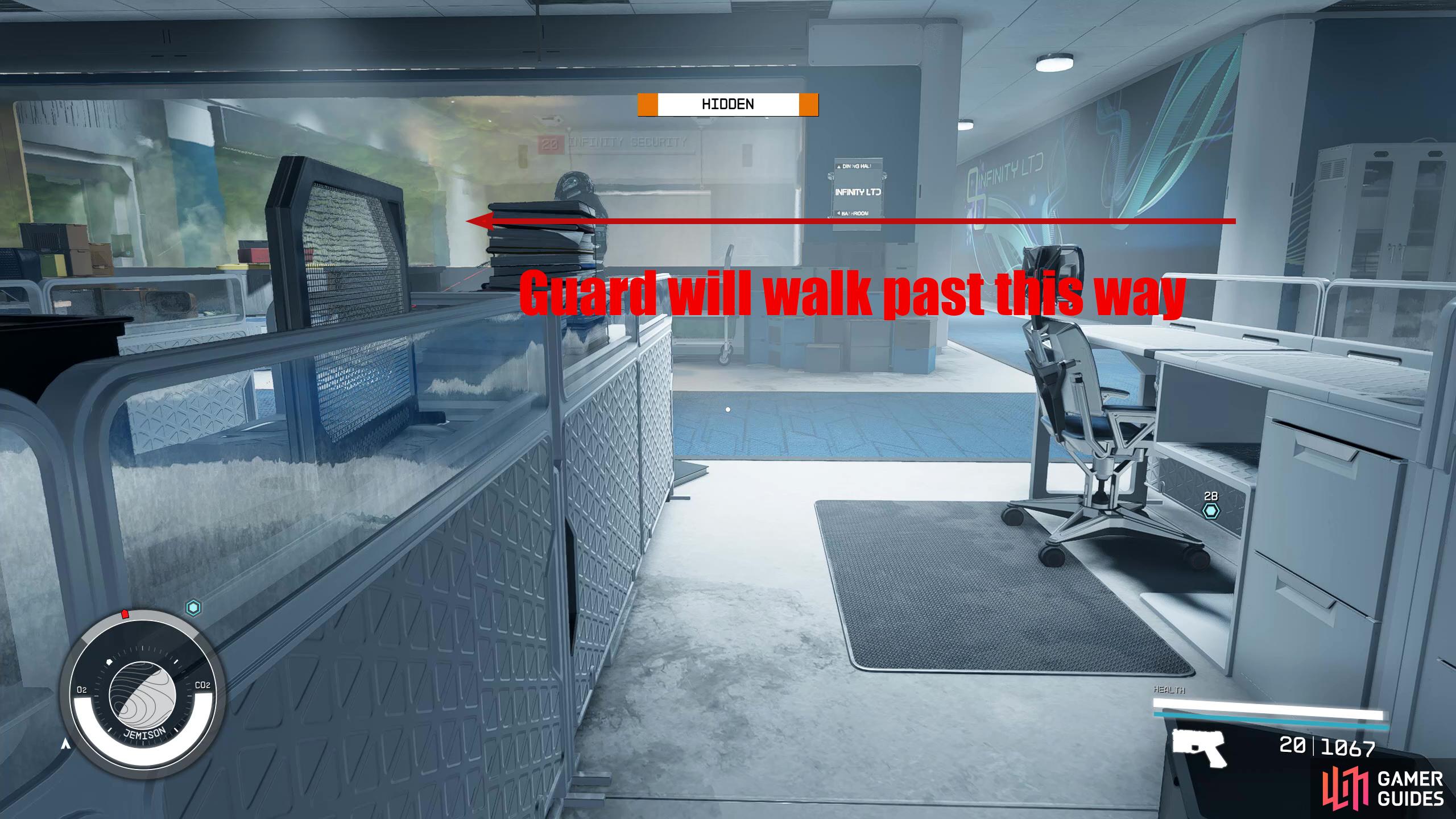 When the top guard has turned, head behind the cubicle to your right and wait for the guard to walk past.