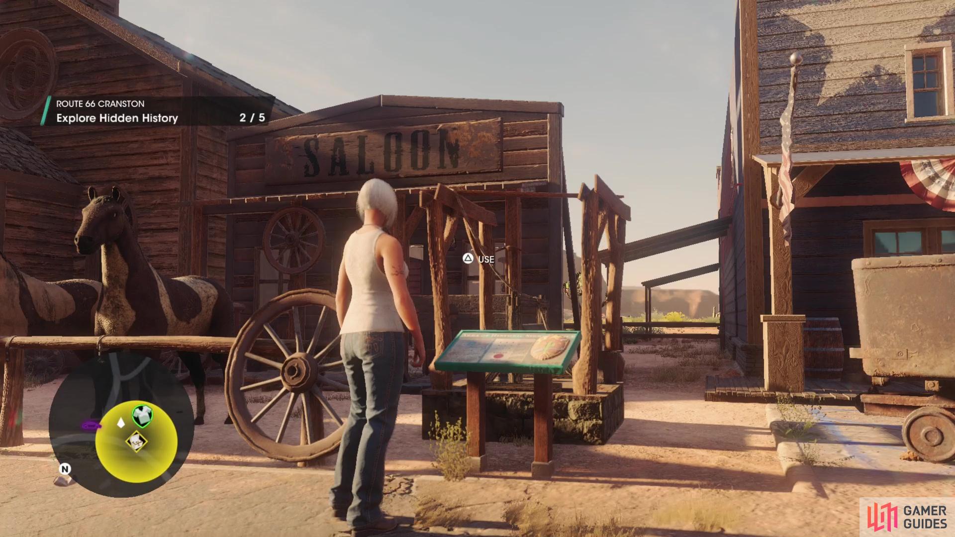 while the fifth and final sign is resting between the faux Saloon and the Ringers building.