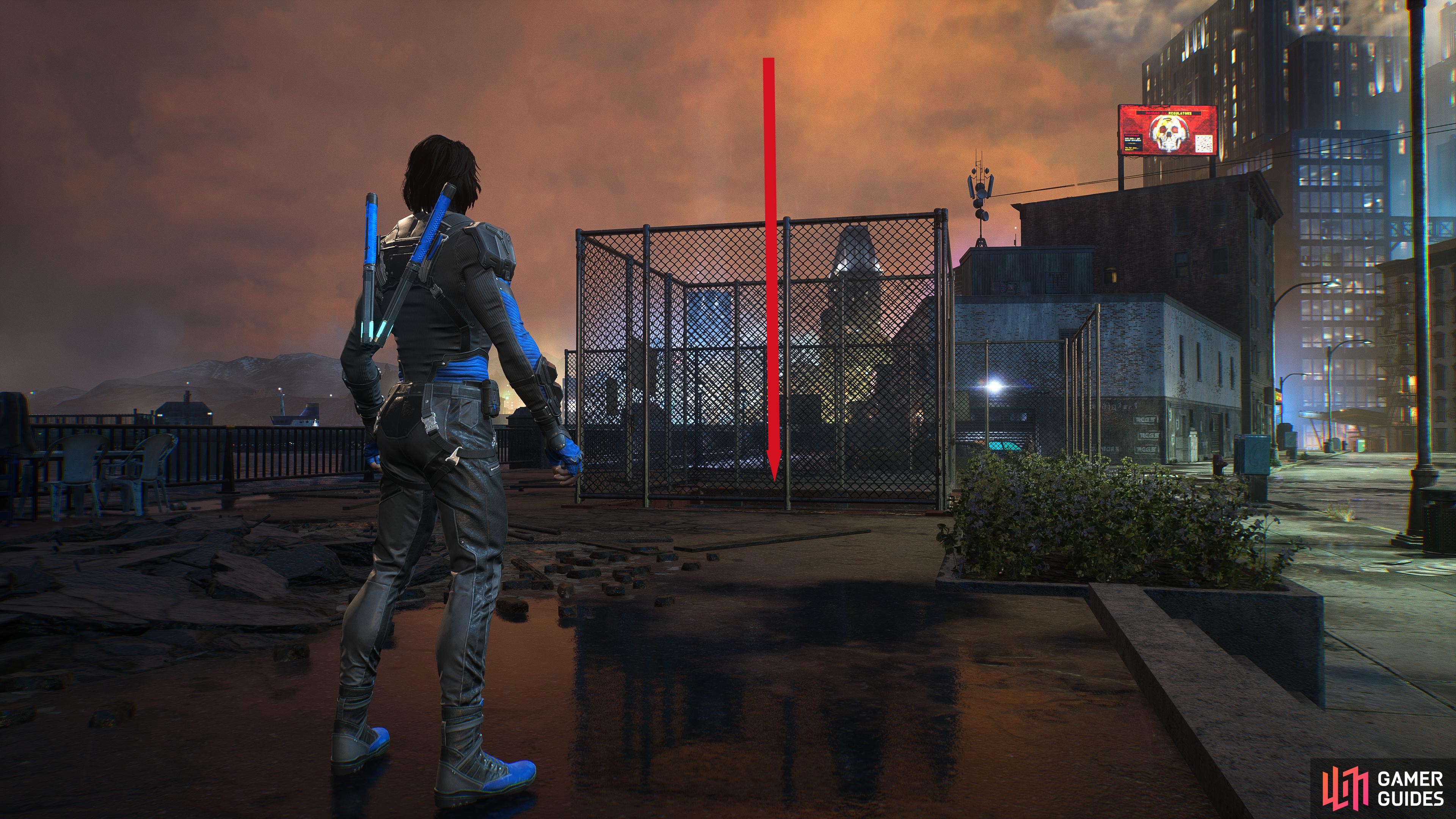 Climb the fence, and drop into the hole.
