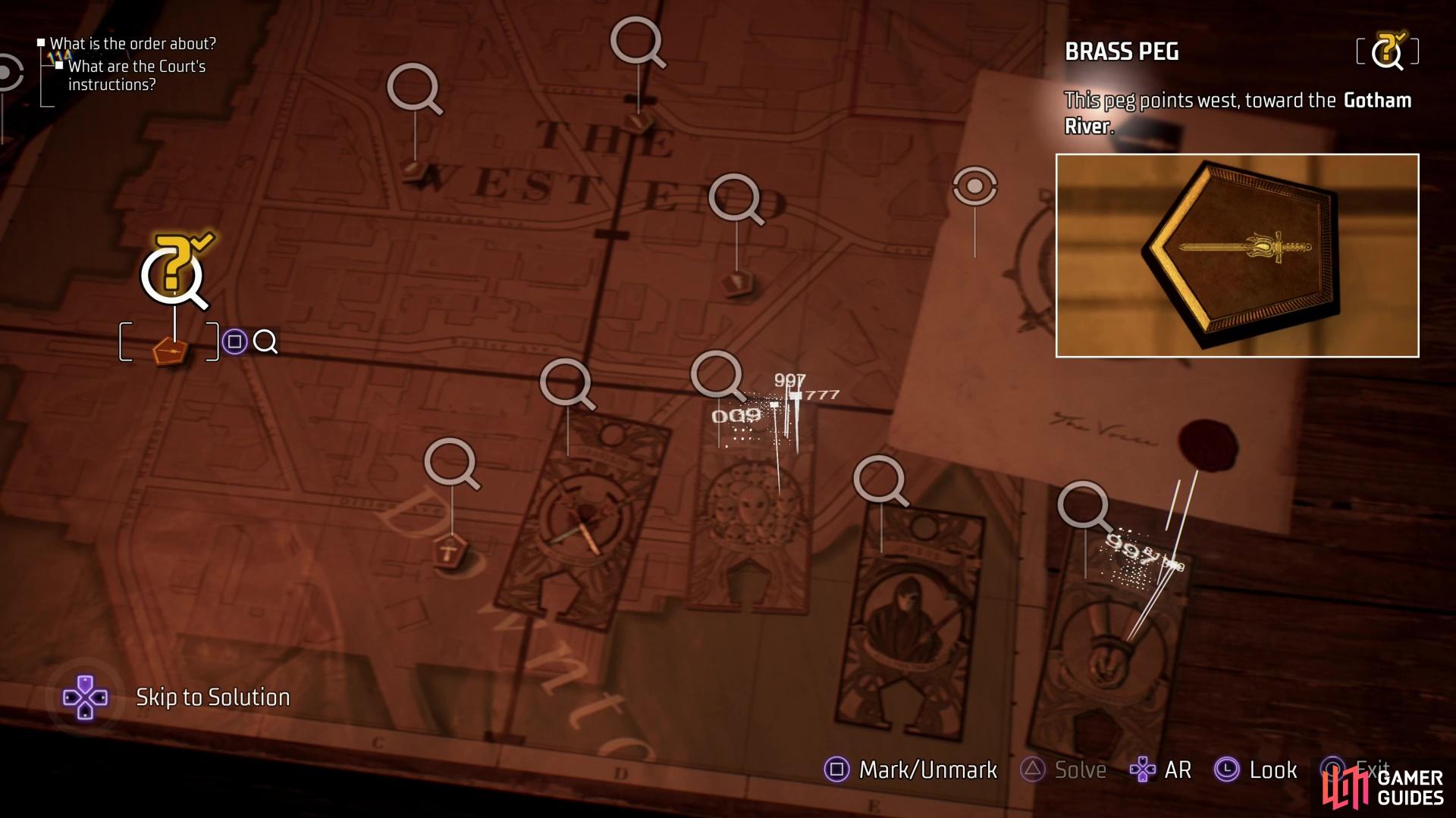 and pegs in a map that indicate a location.