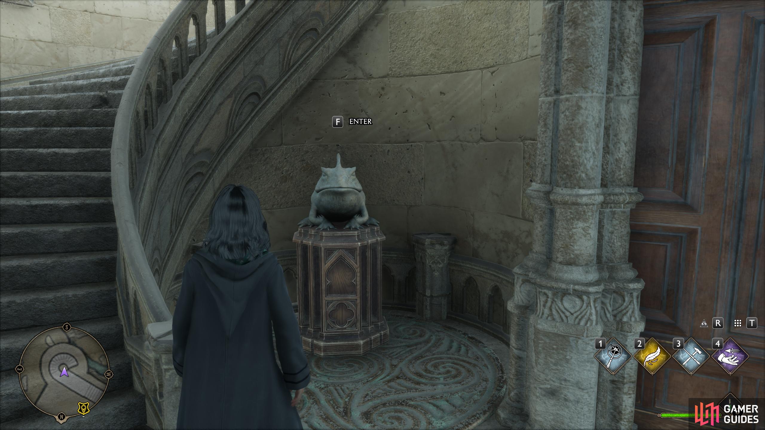 Interact with the statue of the toad to enter the hidden room.