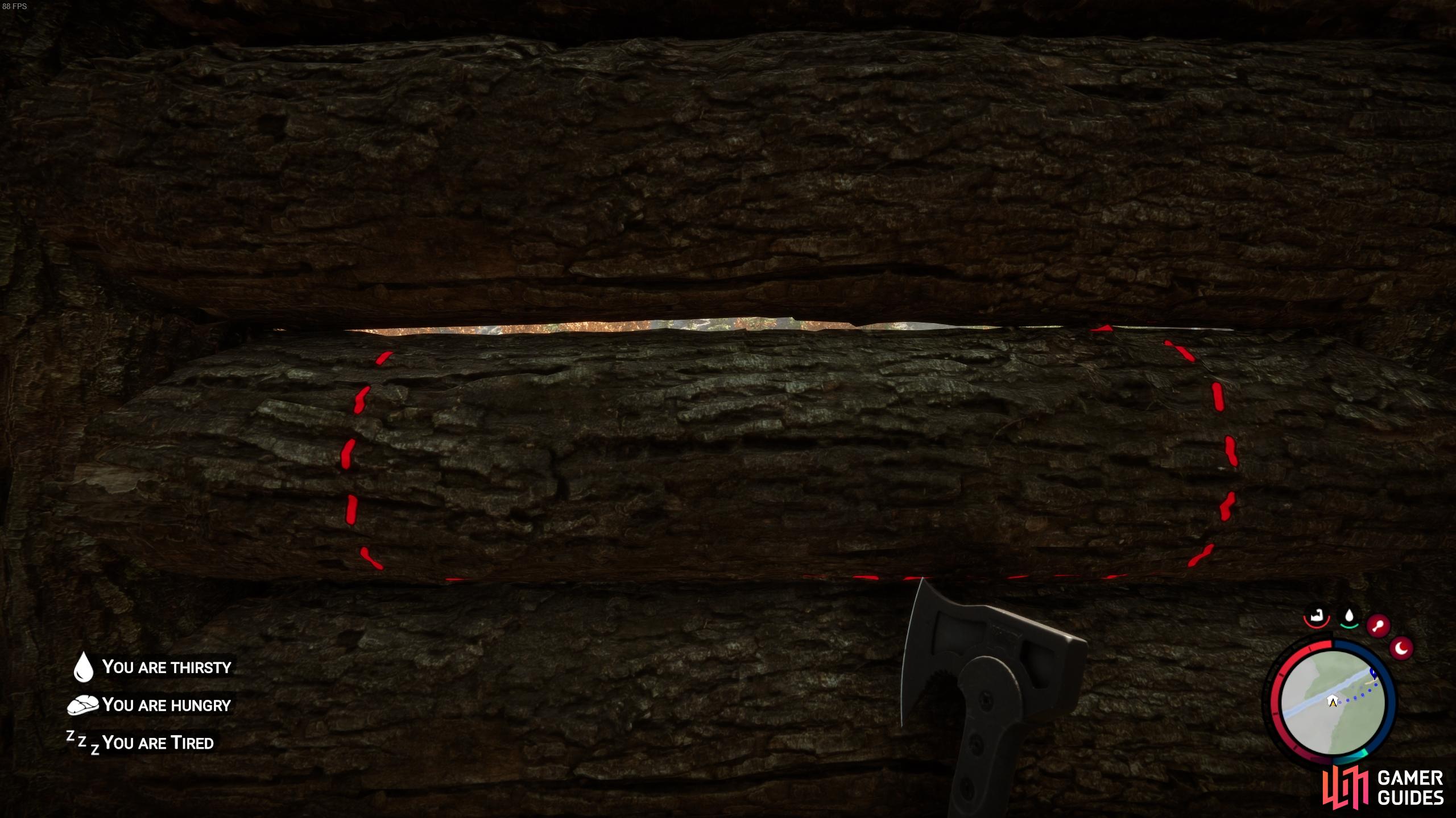 Look directly at a wall to see the red lines where you can chop the wood.