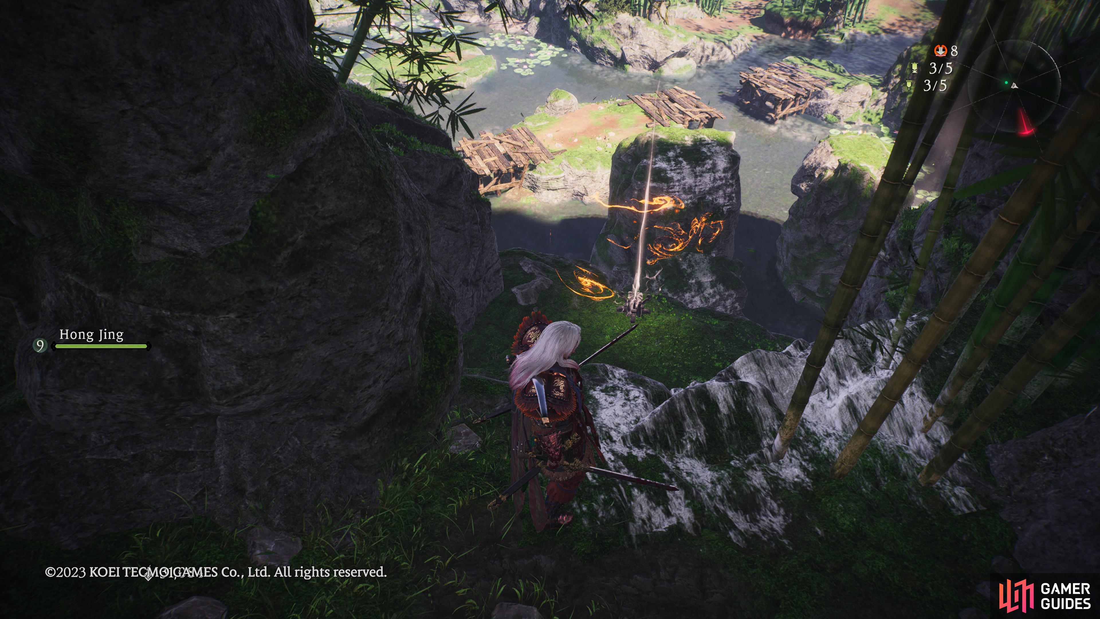You can find this marking flag sitting down a narrow path before the cave