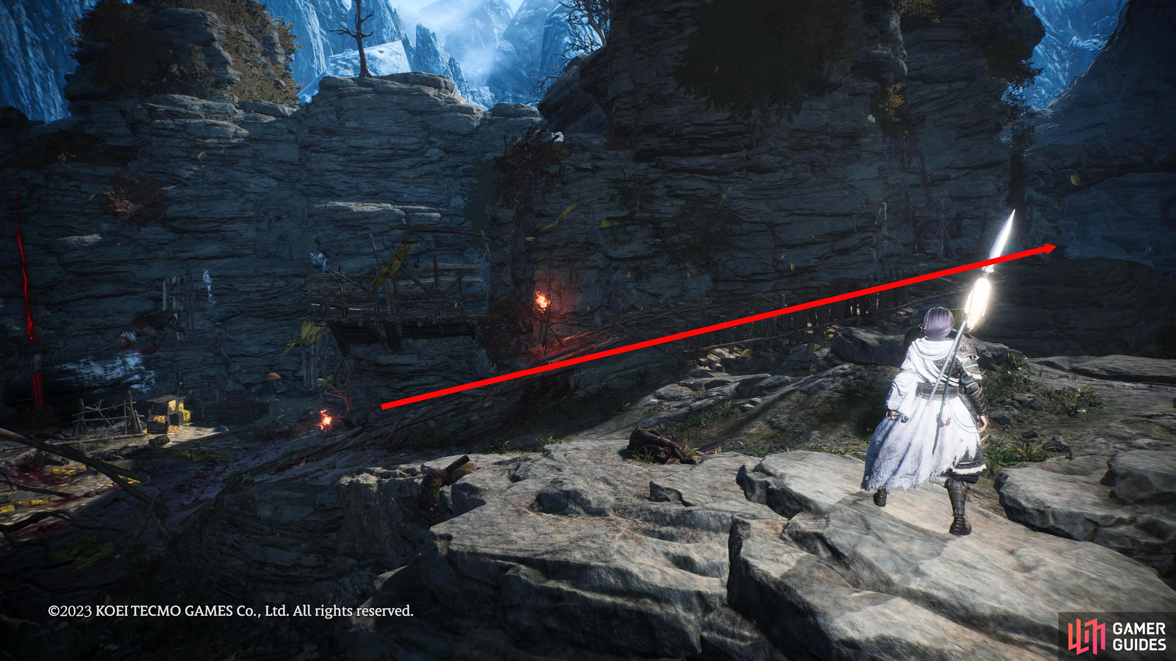 From the Changgui Battle Flag take the right path up the cliff and jump up the blocks around the corner to reach the Warlock.
