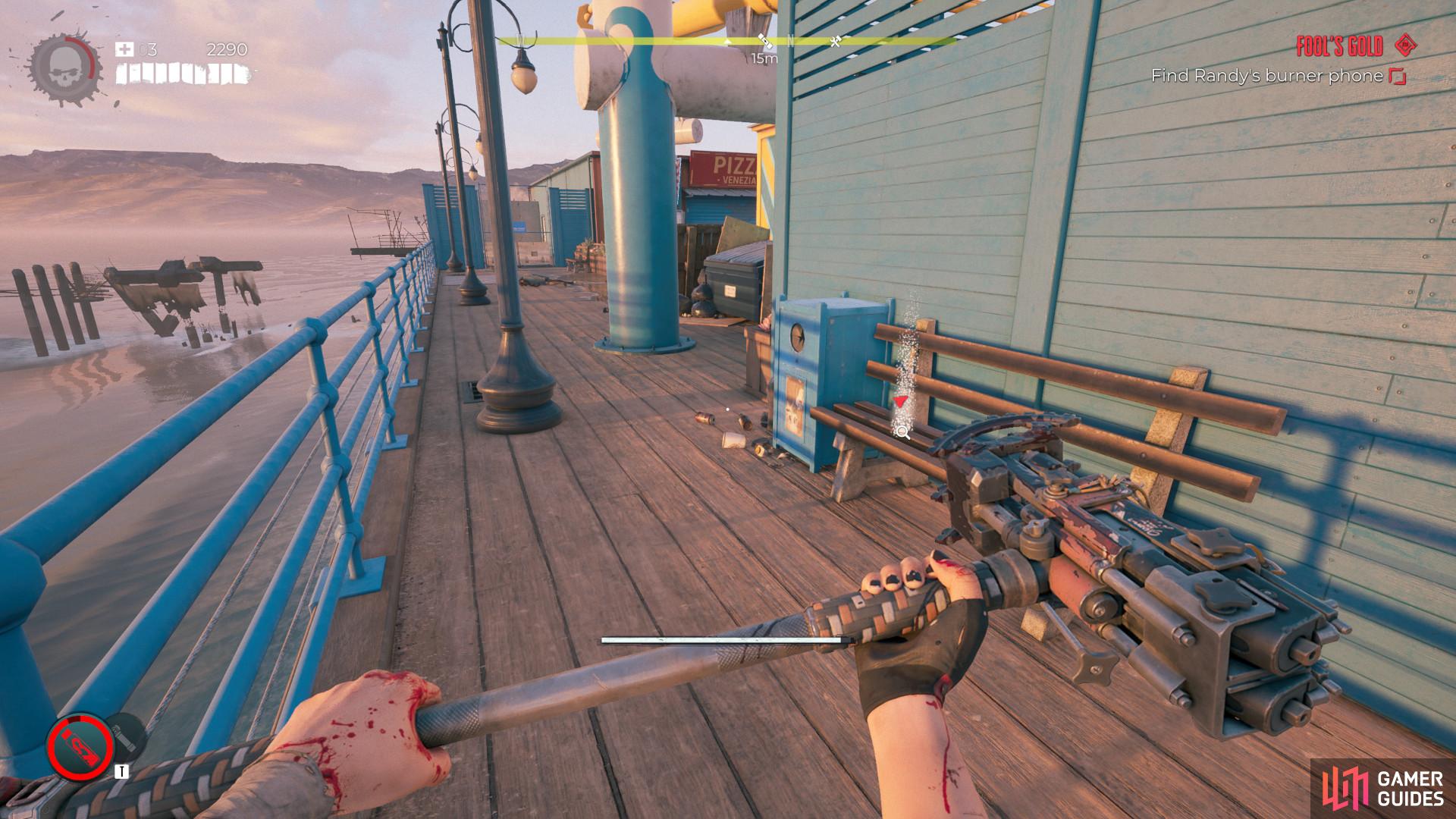 The second Burner Phone in the Fool's Gold quest is on the bench to the southeast of the pier.