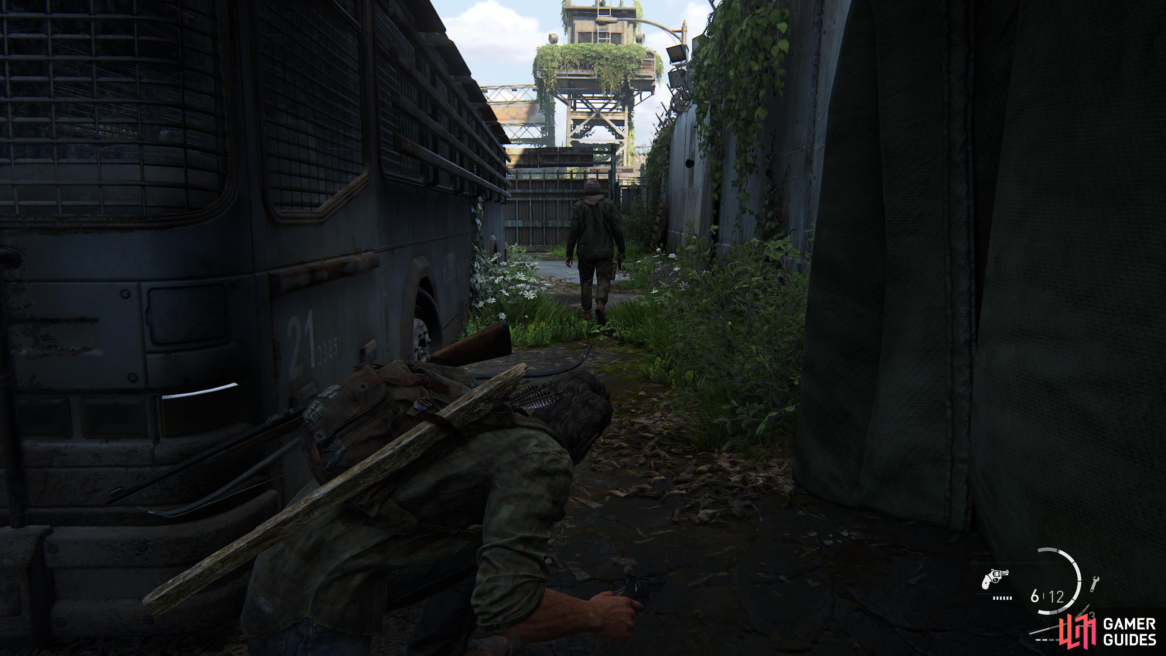 Wait for the guard to walk past the bus and take him out