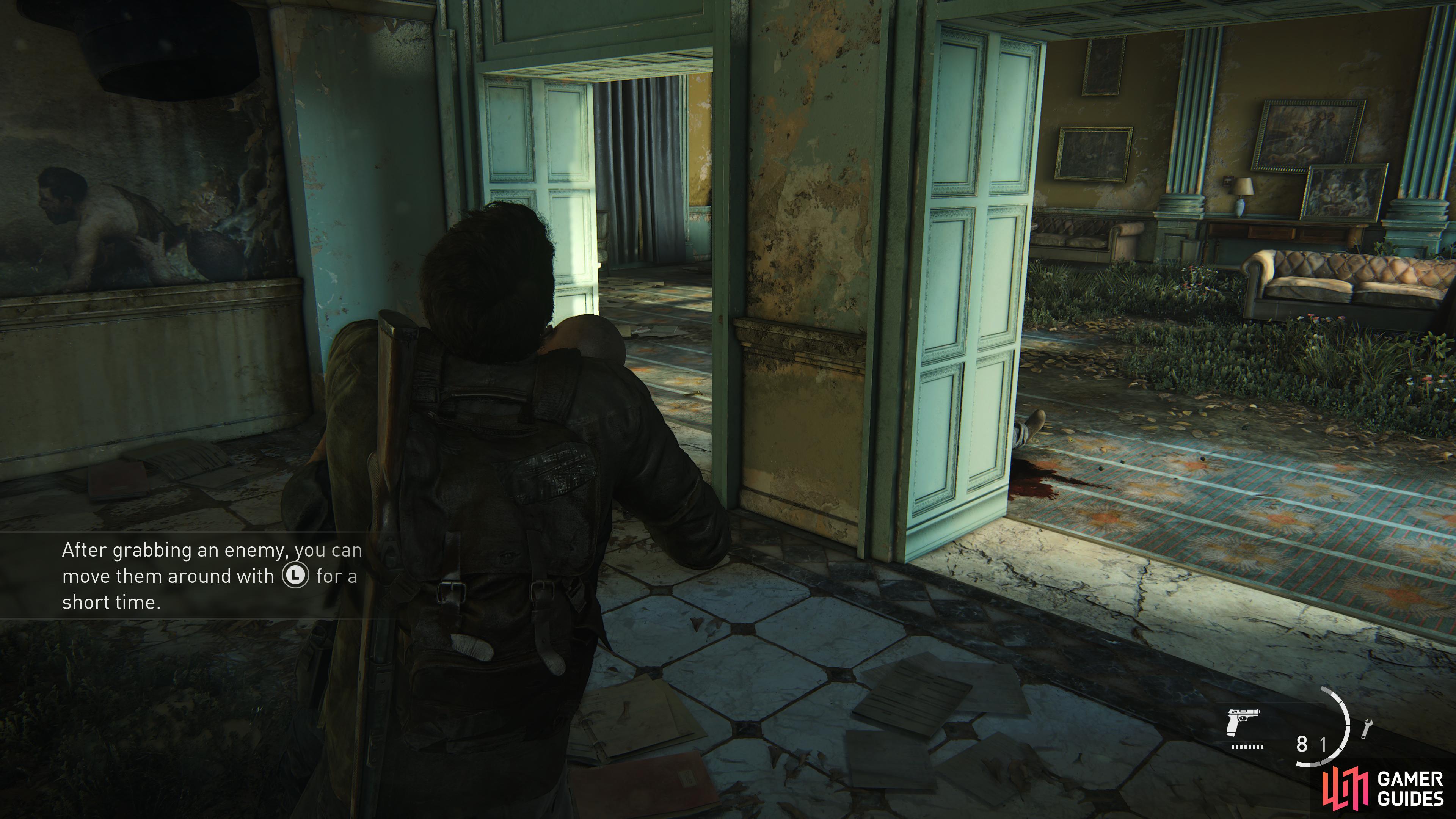 Hide behind a box and wait for the guard to pass you before strangling him.