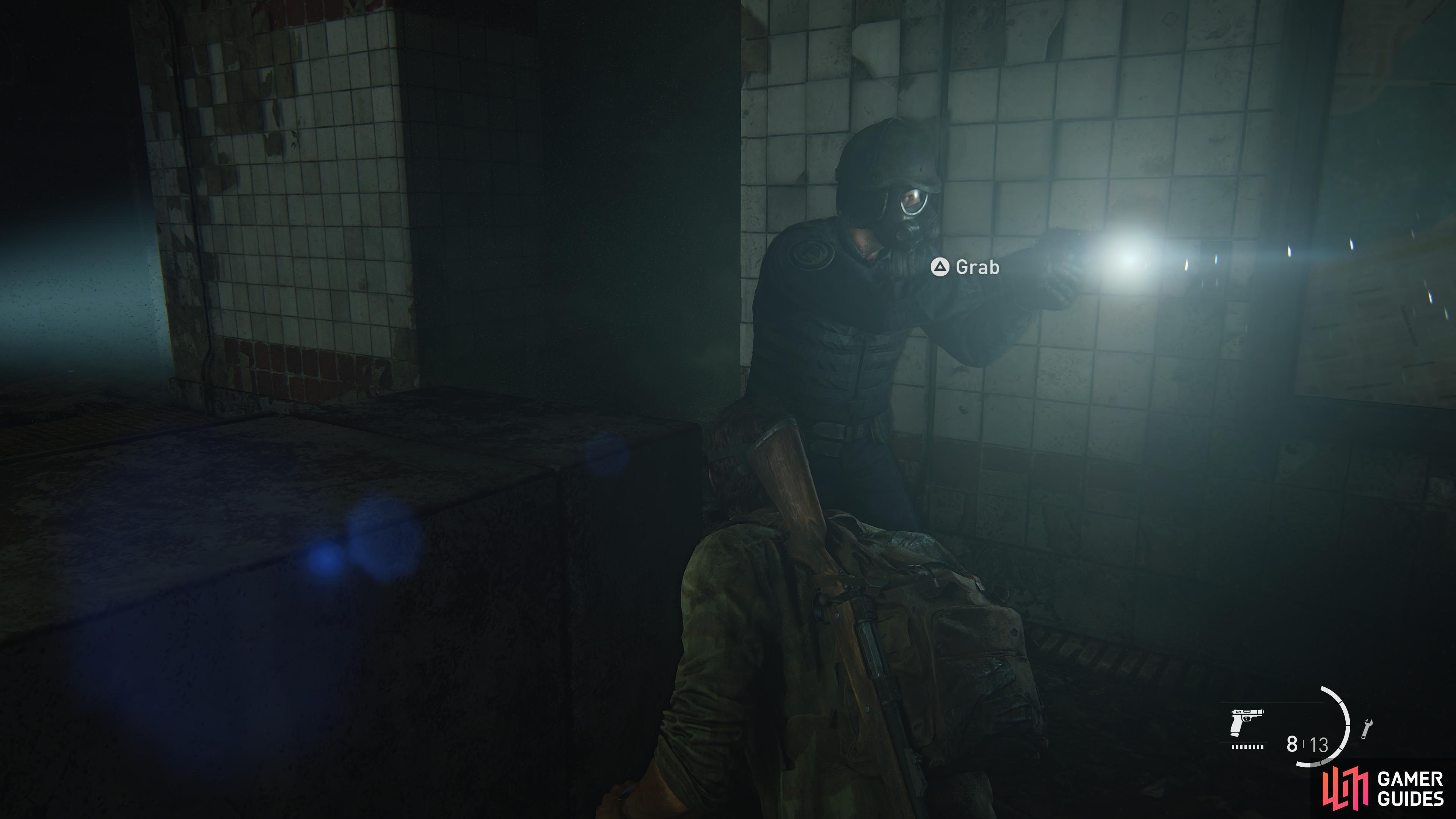 Wait for the guard to walk past and strangle him 