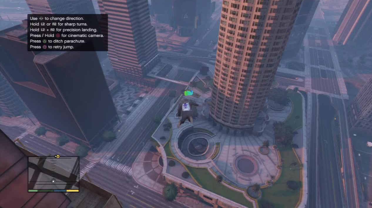 Open your chute at this moment. Use the building to the left as your guide so then you can always get the height right even if you have to replay to get the landing right.