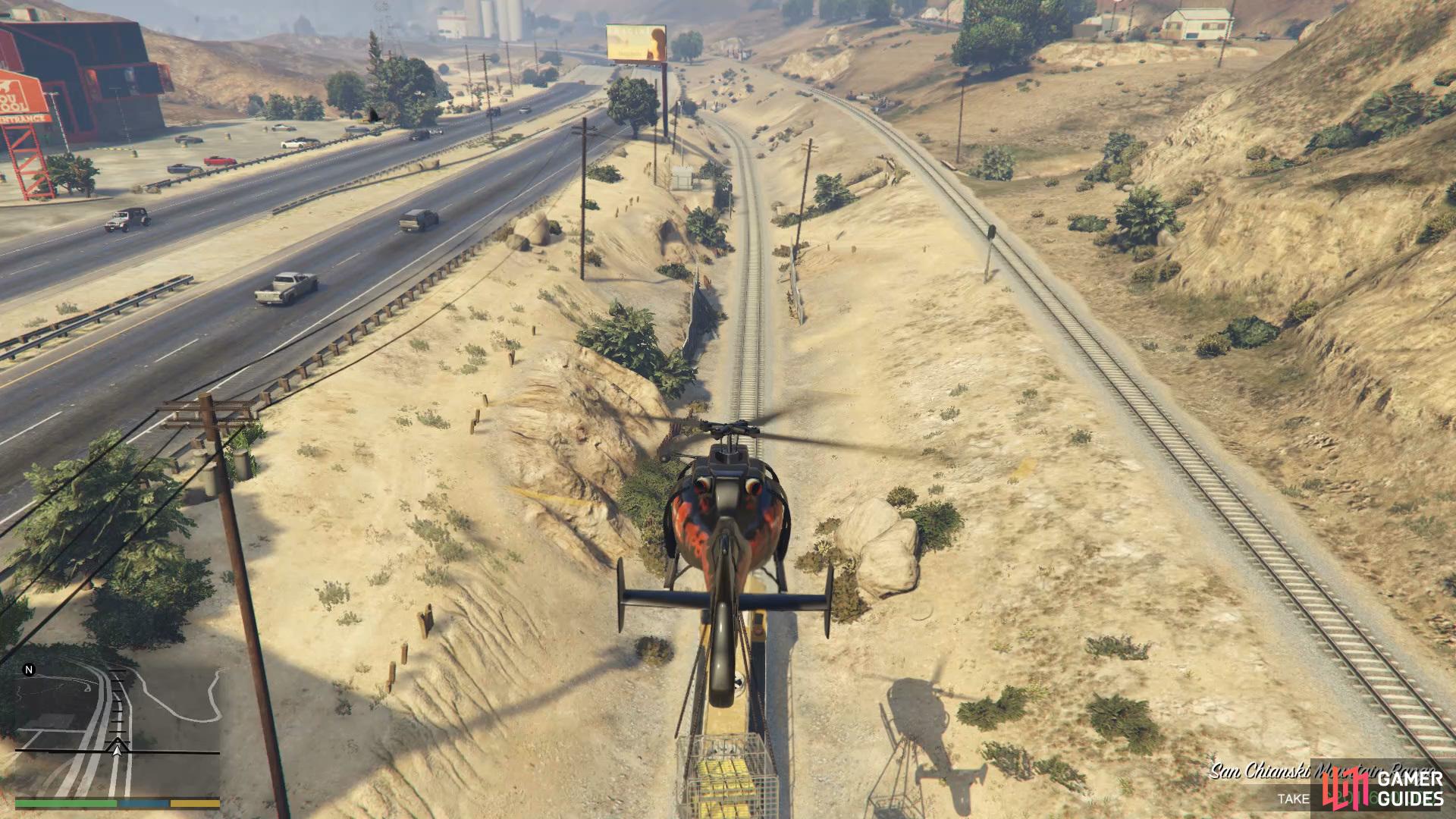 Finally, drop the gold onto the train and fly back to Trevor's Airstrip. 
