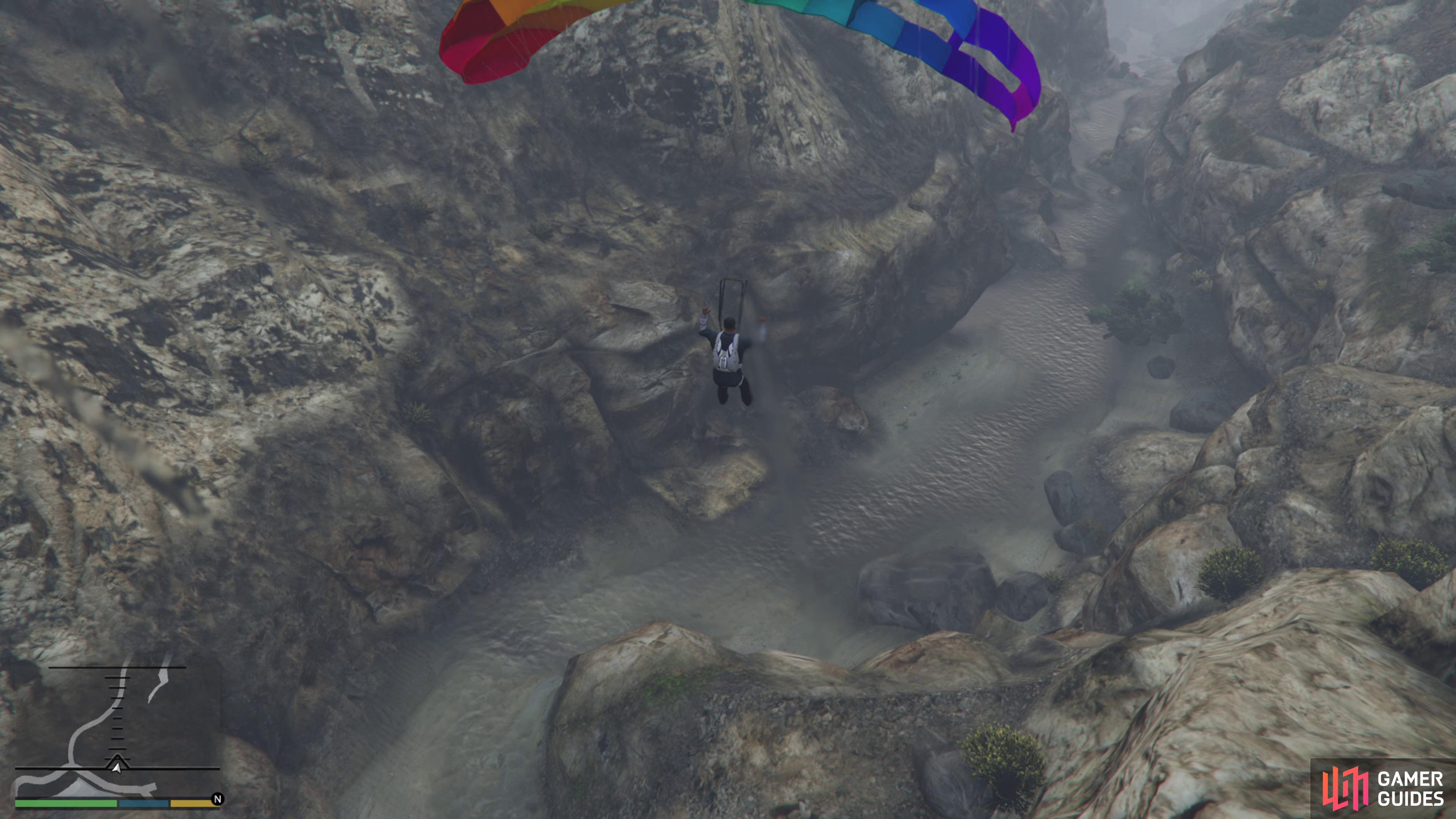 then open the chute as soon as you jump and try not to whack into the cliffs on both sides. Glide down the riverbed and land gently to complete this mission