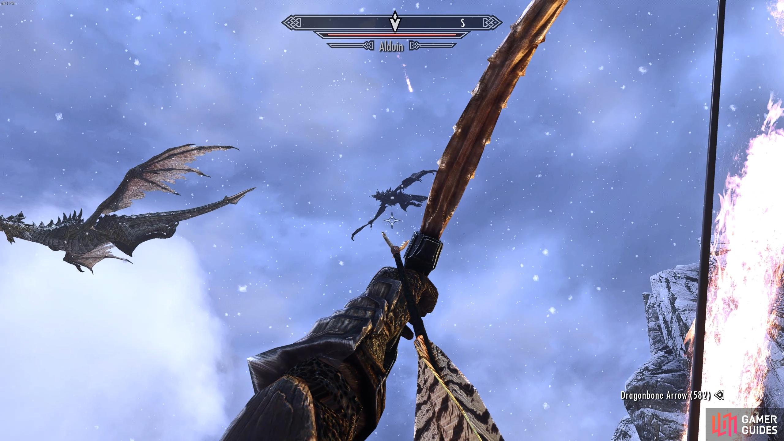 You can shoot Alduin while he's flying, but you'll find it difficult.