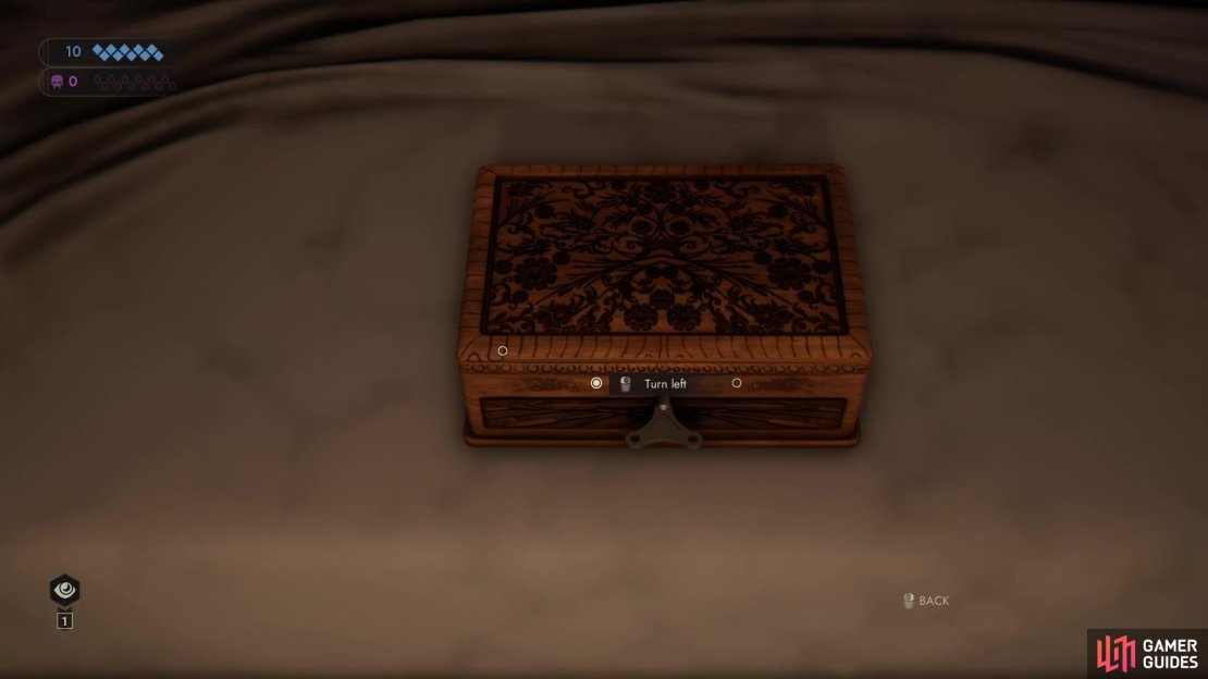 You’ll need to locate a diagram to open the box on Jara Drory’s bed.