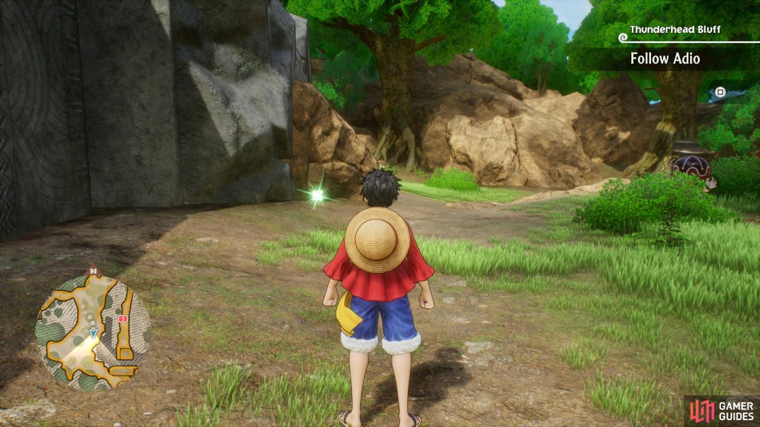 The fragment will be on the floor near the gray rock face.