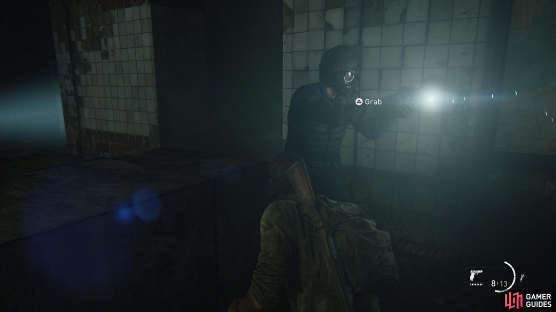 Wait for the guard to walk past and strangle him