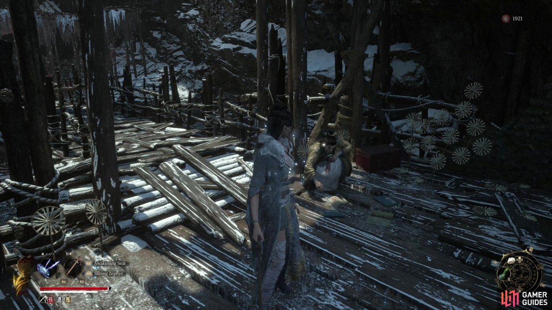 You can find He Youzai at the other side of the bridge, opposite the Bride’s Boudoir shrine. Make sure you have over the notes and scraps to him.