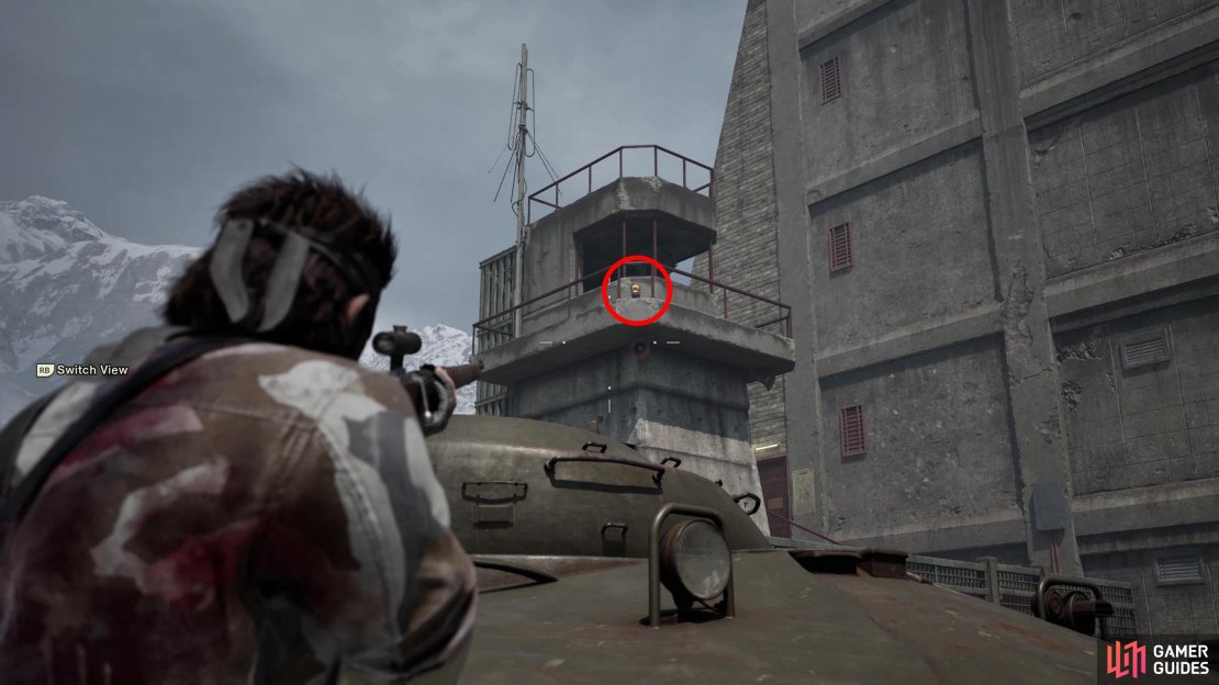 In the first scene of the chase sequence, during Eva’s second stop, look up and left to spot this GA-KO on a guard tower.