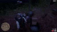 Look on the table next to the clothesline across from the saloon