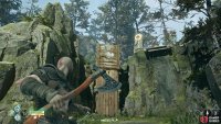Destroy the barricade to boost Atreus up and reach the Lore Marker.