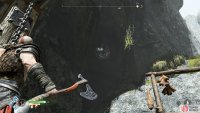 Pull the chain and then throw your axe at the disc to hold the gate in place.