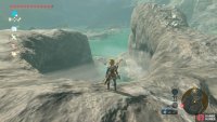 Stand here on the large C-shaped rock