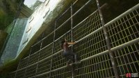 Climb the fence up to the tracks above