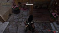 Inspect the bracelet on the floor inside the house.