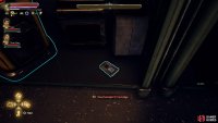 Near a bin by a workbench in the workshop by the landing pad