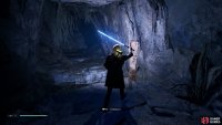 now make your way to the end of the cave and interact with the button to turn the caves lights on.